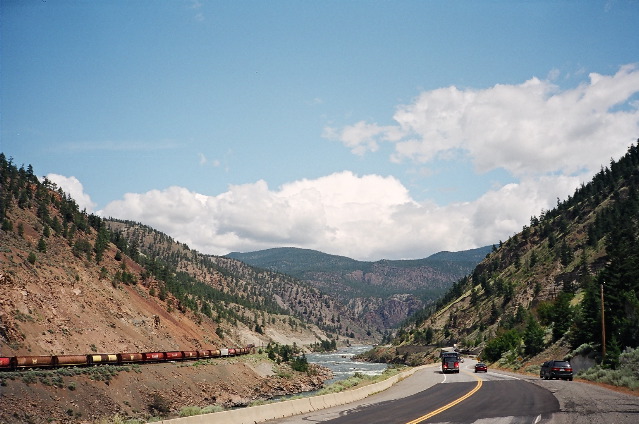 Trans-Canada Hwy in Thompson River Canyon, looking North, up the river. Railway on the left side is CP, railway on the right side is CN